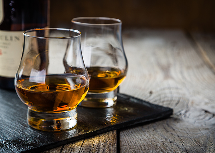 Whiskey with ice in glasses